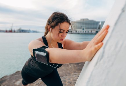 Woman stretching during a run